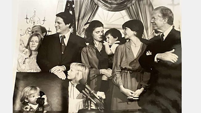 Carol Laskin, Lynne Pilot and their families with President Carter in the Oval Office.